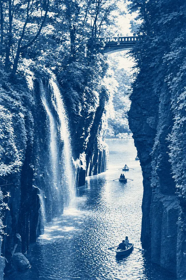 Cyanotype Memory interpretation of a waterfall, gorge, bridge and rowboats.